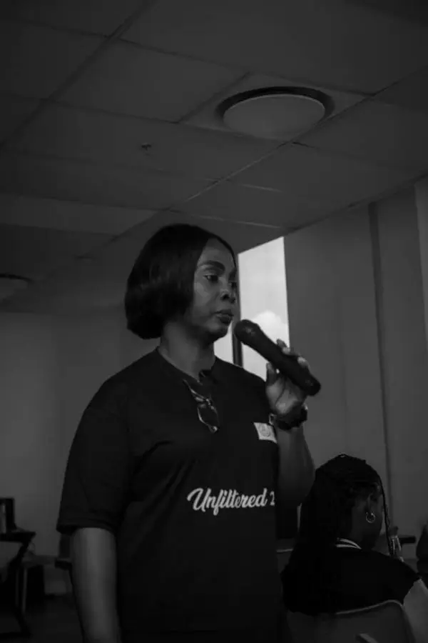 A facilitator speaking to students
